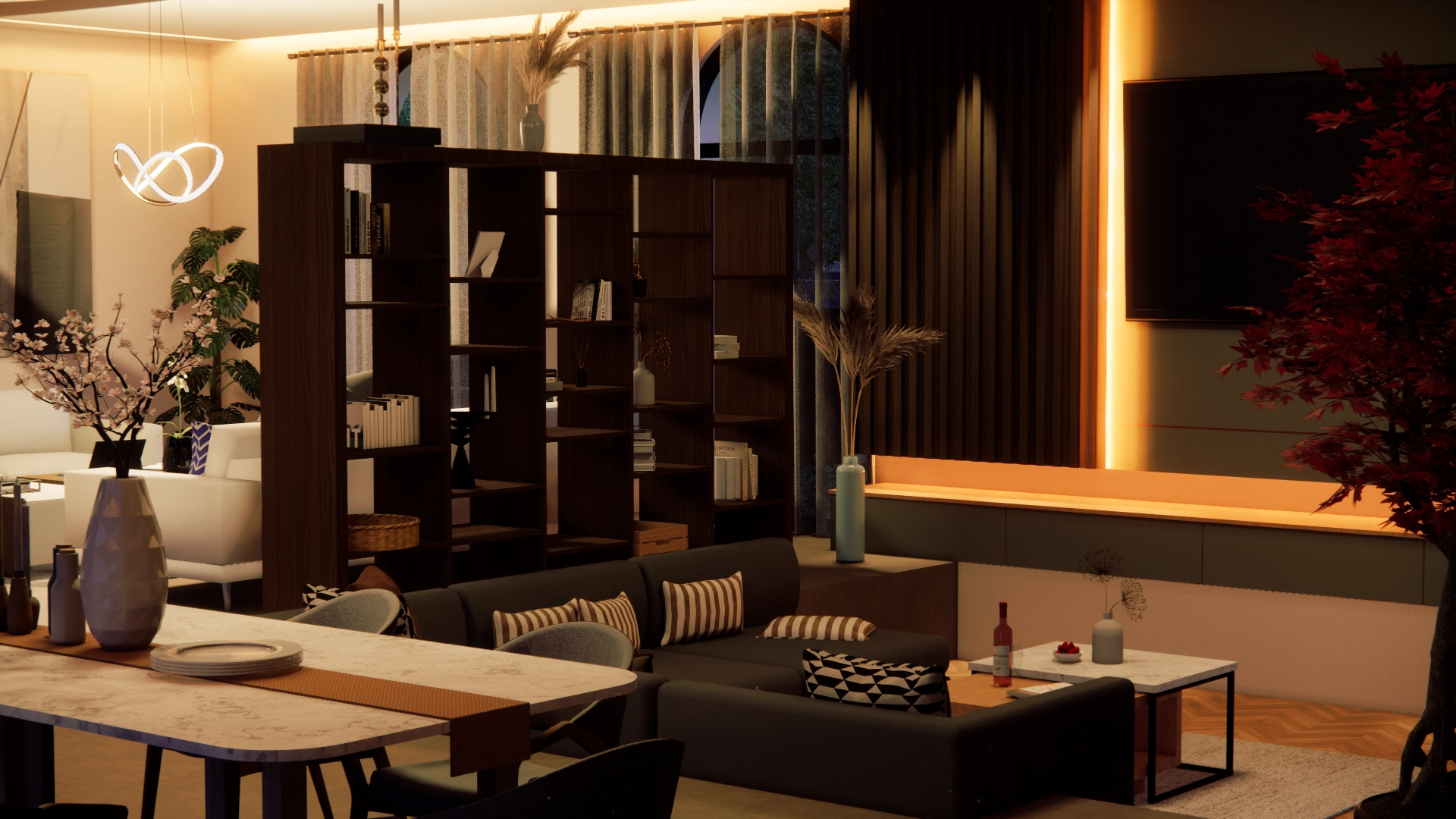 A living room in the evening with warm cove light, open shelving and a dining table